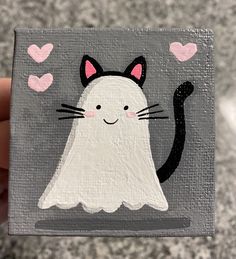 a painting of a cat with hearts in the background