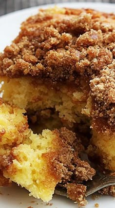 a close up of a piece of cake on a plate with a fork in it