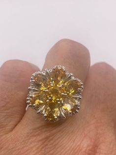 Vintage citrine flower ring Unusual cut in 925 sterling silver setting Handmade Size 6.25 or 6.5  Can be resized, my jeweler charges $20  All rings are shipped in a nice gift box.   Check out our over a THOUSAND great reviews Engraving is $4 per letter and is not always perfect depending on the piece. It can take a few days if the jeweler is busy. This is payable to Paypal Judithsltd@gmail.com  PLEASE NOTE If we have multiples of the same vintage item, it is because we often purchase factory rem Yellow Flower-shaped Formal Jewelry, Formal Yellow Flower-shaped Jewelry, Formal Gemstone Rings With Flower Shape, Formal Flower Shaped Gemstone Rings, Formal Flower-shaped Gemstone Rings, Yellow Flower Shaped Jewelry For Anniversary, Yellow Flower-shaped Jewelry For Anniversary, Yellow Flower Shaped Jewelry For Formal Occasions, Elegant Yellow Flower-shaped Ring