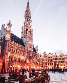 an ornate building with many spires and lights