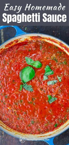 easy homemade spaghetti sauce in a blue pan with basil leaves on top and text overlay that reads easy homemade spaghetti sauce