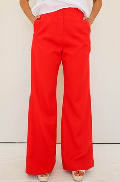 Product details: Wide legged pant Detailed waistline Zipper and button closure V-detailing on back waistline Functioning pockets Comfortable, baggy fit Stretch fit with spandex High quality Model is 5'6" wearing a size S Size Chart: Size Waist Length Inseam Front Rise S 26" 43.5" 32" 12" M 27" 44" 32" 12.5" L 30" 44" 32" 12.5" Outfit Details: Boardroom White Satin Blouse Boston White Linen Blouse Big City Cream/Red Tweed Blazer Self + Care Instructions: Self: 97% Polyester, 3% Spandex Lining: 10 Red Wide Leg Pants With Pockets, Red Wide Leg Cargo Pants, Red Straight Leg Bottoms With Button Closure, Red Workwear Pants With Button Closure, Red Work Pants With Welt Pockets, Red Workwear Pants With Welt Pockets, Red Wide Leg Dress Pants For Spring, Red Wide Leg Pants With Pockets For Fall, Red Straight Leg Pants With Welt Pockets