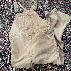 "Title: Dickies overalls Size: 36 x 34  Made in: Mexico Material: Cotton Measurements pending: Waist: 40\" Inseam: 33\" Notes: Great wear and fading" Vintage Fitted Overalls For Workwear, Brown Workwear Overalls With Pockets, Vintage Brown Cotton Overalls, Vintage Bib Front Overalls With Pockets, Military Style Cotton Overalls, Dickies Overalls, Work Overalls, Mens Overalls, Vintage Levis