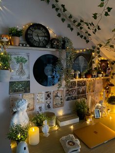 a room with many plants and pictures on the wall