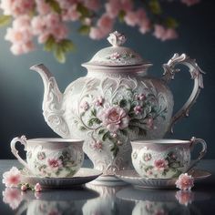 an ornate tea set with pink flowers on it