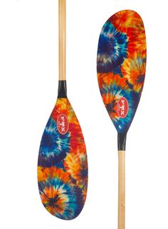 two paddles with different colors and designs on them