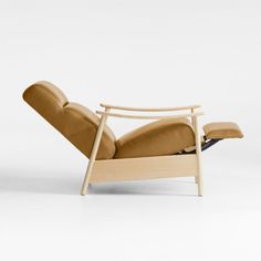 the reclining chair is made out of wood and leather