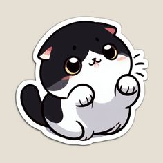 a black and white cat sticker sitting on top of a gray surface with its paws up