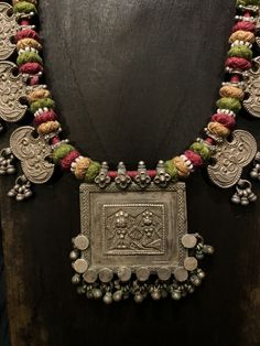 Get lost in the detail and unique beauty of antique silver Banjara beads strung onto a beautifully woven cord, handcrafted in India. All of our jewelry is one of a kind, handmade, and fair trade. A truly one of a kind piece, this necklace features the breathtaking intricacy of century old Banjara silverwork which is gracefully contrasted by the colorful and intricate woven cord they’re strung upon. The Banjara are one of the ancient nomadic tribes in India and have been known for centuries for t