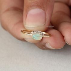 Gorgeous Oval Opal Ring, SI Clarity Diamond Crown Ring, 14K Gold Diamond Ring , Dainty Wedding Ring, Engagement Ring, Petite Ring For Her, Fine Handmade Beautiful Jewelry.Also available in Rose Gold, Yellow Gold and White Gold.Product info:14k solid goldGemstone : OpalStone Shape : OvalStone Size : 6x4 mmSI Clarity Natural, DiamondDiamond Weight : 0.08 ct ApproxRing Size 7Item will be resized and shipped within 10 days.ITEM Will BE SHIPPED : India Speed PostTo get the item in 4-5 days, we can al Oval Opal Ring, Diamond Crown Ring, Dainty Wedding, Dainty Wedding Ring, Petite Ring, Diamond Crown, Zierlicher Ring, Pave Diamond Ring, Crown Ring