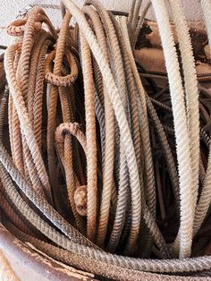 there are many different types of rope in this basket, and one is on the floor