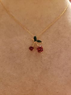 "This is the CUTEST necklace!! A 7mm and a 5mm round red CZs are the Cherries; the little leaves have green CZs set against black rhodium. *The stones are MUCH more sparkly than what shows in the photos* Entire piece is Sterling Silver layered with Yellow Gold Overall pendant measures 3/4\" x 5/8\" Hallmarked 925 FZN China Brand New Contact me with any questions" Red Jewelry With Adjustable Chain For Anniversary, Red Necklace For Christmas Anniversary, Red Round Necklaces For Gift, Red Round Necklaces As A Gift, Red Round Necklace For Gifts, Red Clavicle Chain Jewelry With Round Pendant, Red Clavicle Chain With Round Pendant, Red Necklace With Adjustable Chain, Elegant Cherry Colored Necklace For Gift