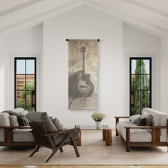 a living room with two couches and a guitar painting on the wall above them