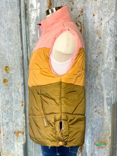 The STS Ranchwear Sherbet vest is a medium weight 3-tone puffy vest. This vest will keep you warm while adding a pop of color to your outfit. + 3-Tone- Pink, Tan, and brown + Zip closure + Snap closure hand pockets + Snaps on side to keep the vest from riding up while sitting or riding. + Fits true to size Puffy Vest, Medium Weight, Snap Closure, Color Pop, Pink, Color