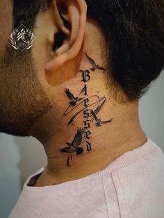 a man with a tattoo on his neck