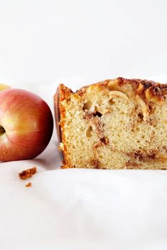 a piece of cake next to an apple