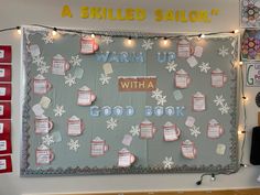 a bulletin board that has been decorated with snowflakes