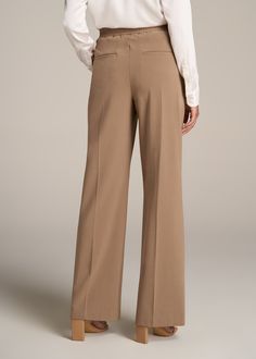 About Our Flat Front Wide Leg Dress Pants for Tall Women Ultra-flattering and easy to wear, these women's tall dress pants are a closet essential. They feature a smooth front with a contoured waistband for a complimentary finish. Pleated accents at the front and back elongate your legs and make them easy to wear from the desk to dinner. Built with a stretch-infused polyester-viscose blend, these pants for tall women offer the sleek feel of a suit with the comfort of a lounge pant. An elastic at Elegant Ankle-length Dress Pants With 4-way Stretch, Elegant Ankle-length 4-way Stretch Dress Pants, Elegant 4-way Stretch Ankle-length Dress Pants, Elegant Elastane Wide Leg Pants, Spring Classic Elastane Dress Pants, Classic Spring Dress Pants With Elastane, Loosely Fitted Full Length Solid Dress Pants, Classic Spring Dress Pants, 4-way Stretch Dress Pants For Spring Workwear