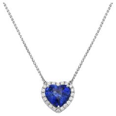 With this diamond and sapphire heart-shaped pendant, style and glamour are in the spotlight. This 18-karat diamond and sapphire heart-shaped pendant is made from 1.3 grams of gold. This pendant is adorned with VS2, G color diamonds, made out of 20 round diamonds totaling 0.23 carats and 1 sapphire totaling 3.02 carats. Platinum Pendant, Titanic Jewelry, Heart Shaped Pendant, Heart Pendant Diamond, In The Spotlight, Heart Shape Pendant, Yellow Sapphire, Diamond Heart, Heart Pendant