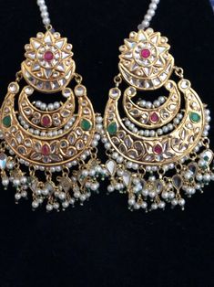 Elegant in it's simplicity, these beautifull thappa kundan earrings and mang tikka set! Very lightweight and 22 kt gold plated earrings and mang tikka in stock and ready to ship. Kundan Temple Jewelry Earrings For Festivals, Temple Jewelry Kundan Earrings For Festivals, Festival Kundan Temple Jewelry Earrings, White Kundan Chandbali Chandelier Earrings, Hand Set Chandbali Kundan Necklace As Gift, Festive Navratri Jewelry With Matching Earrings, Heavy Temple Jewelry Earrings For Diwali, Festive Matching Earrings For Navratri, Kundan Chandbali Earrings In Temple Jewelry Style