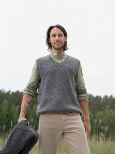 Knitted vest is made of skin soft mohair and merino wool yarns. Minimalist style mens vest is inspired by classic Scandinavian style. Garment features V neckline. Hand knitted vest looks great with casual style shirts. Warm and comfortable woolen vest delivers simplicity, style and ability to wear this sweater whenever you are spending time in nature or going to the theater, restaurant with your family or friends.  Composition: 30% Mohair wool, 70% Superfine Merino Wool Model's heigh: 181 cm  We Knitted Wool Vest For Fall, Casual Wool Sleeveless Vest, Sleeveless Wool Sweater Vest For Fall, Casual Sleeveless Wool Vest, Men Knitted Vest Outfits, Sleeveless Knit Sweater Vest For Winter, Wool Knit Sweater Vest For Winter, Knitted Wool Vest For Winter, Wool Sleeveless Vest For Winter