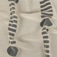 a zebra print fabric with black and white stripes on it's back end,