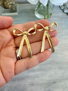 Beautiful gold stud bow earrings measuring approximately 1.5". Perfect for gifts, summer jewelry, bridesmaid gifts, and everyday jewelry! Giftbox included! Gold Wedding Jewelry With Butterfly Knot Detail, Gold Butterfly Knot Jewelry For Gift, Gold Earrings With Decorative Bow As Gift, Gold Jewelry With Butterfly Knot For Gift, Elegant Gold Jewelry Gift Wrapped, Chic Gold Earrings For Gift, Chic Butterfly Knot Jewelry Gift, Chic Gold Earrings With Decorative Bow, Chic Gold Earrings With Bow