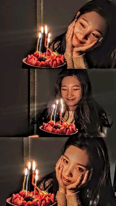 a woman holding a cake with candles on it