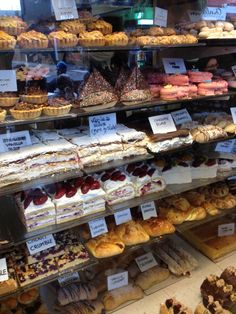 a display case filled with lots of different types of pastries