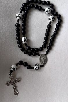 Gate of Heaven Rosary 🌹 Hail Mary beads 8mm dyed wooden black beads   Our Father beads 10mm ceramic black floral bead.  Durable micro cord  silver crucifix and immaculate conception center piece  This rosary is composed by the description above.  🌹 Say the Holy Rosary. Blessed be that monotony of Hail Mary's which purifies the monotony of your sins!"   -St. Josemaria Escriva With your rosary you'll receive a muslim reusable drawstring bag that can be used as a rosary pouch!  ⭐️ Because I use n Black Wooden Beads Rosary Spiritual Style, Black Wooden Beads Rosary, Black Wooden Beads Spiritual Rosary, Rosary Pouch, Black Rosary, Beads Gifts, Prayer Catholic, Wooden Rosary, Rosary Beads Catholic