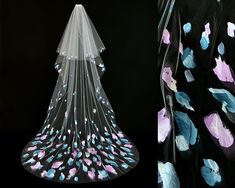 a wedding veil with blue and pink flowers on it, next to a black background