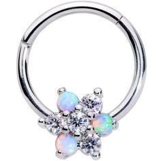 an opal flower with white stones in the center is attached to a captive ring