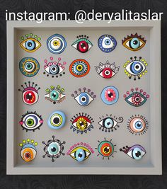 an art display with many different colored eyes