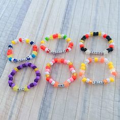 kandi inspired by one of my favorite series ! -made with plastic pony beads -made with elastic Cute Beaded Plastic Stretch Bracelet, Friendship Beaded Bracelets With Letter Beads, Fun Plastic Beaded Bracelets With Letter Beads, Fun Plastic Stretch Bracelet With Round Beads, Pony Bead Bracelets, Kandi Bracelets, Bead Charms Diy, Diy Bracelets Patterns, Pony Beads