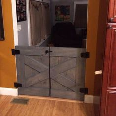 an open barn door in the middle of a living room