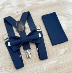 Your special guy will look so handsome when he shows up in his Navy Blue bow tie, pocket square and suspenders!  Great set for groomsman, best man or ring bearers - This bow tie & suspenders set is a great choice for family photos, wedding, ring bearer outfit, birthday celebration or any other special occasion.  When making a purchase, you can choose from the following options : -Suspenders Only -Bow Tie Only. -Suspenders + Bow Tie Set. - Pocket Square only. -3 Pieces Set : bow tie + suspenders Navy Blue Bow Tie, Blue Bowtie, Navy Bow Tie, Outfit Boho, Bearer Outfit, Bowtie And Suspenders, Ring Bearer Outfit, Blue Bow Tie, Suspenders Set