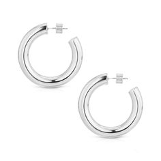 Zolen Hoops are brass hollow hoops with hypoallergenic surgical steel posts. Measurements: Inside Diameter: 1" Outside Diameter: 1.5" Thickness: 7mm Finishes available: 10K Gold Rhodium Our jewelry is always handmade from sustainable materials in the USA. *Editors note: Each hoop is handmade and can vary slightly in size. Modern Metal Open Circle Hoop Earrings, Modern Small Hoop Earrings Internally Threaded, Minimalist Internally Threaded Metal Hoop Earrings, Modern Small Hoop Earrings With Internal Threading, Modern Internally Threaded Hoop Earrings For Everyday Wear, Minimalist Metal Hoop Earrings With Shiny Finish, Polished Metal Round Hoop Earrings, Modern Round Huggie Earrings, Modern Open Circle Pierced Hoop Earrings