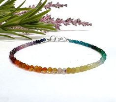 This colorful, dainty beaded bracelet is made with tiny 2mm faceted round gemstone beads in a rainbow of gorgeous colors! The gemstones are arranged in an ombre shaded pattern, and include a variety of semi-precious stones and crystals carefully strung on flexible aluminum wire. Perfect for celebrating or showing your support for Pride, or just for those who love rainbows and colorful jewelry! This piece can also be made as an anklet or necklace, just select the length you prefer or message us w Pride Jewelry, Pride Jewellery, Bracelet Rainbow, Colorful Bracelet, Yellow Opal, Rainbow Gemstones, Bead Choker, Rainbow Bracelet, Rainbow Beads