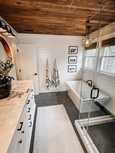 a white bathroom with black and white decor