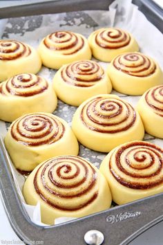 several cinnamon rolls in a baking pan on a table with the words super soft cinnamon rolls