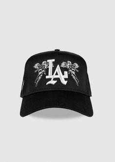 A premium everyday staple item. Featuring a universal 5-panel body along with premium puff embroidery. Details 65% Polyester / 35% Cotton Structured Firm Front Panel 5-panel cap Matching fabric undervisor Adjustable snap - one size fits most Flat embroidered 'Angel" design on front + Signature Slash logo on side panel Puff embroidered 'LA' logo on the front Cool Cap Design, Ny Cap, Streetwear Caps, Braid Styles For Men, Custom Fitted Hats, Puff Embroidery, Streetwear Hats, Cholo Style, Dope Hats