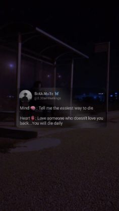 two people standing in front of a bus stop at night with the caption'i love someone who doesn't love you