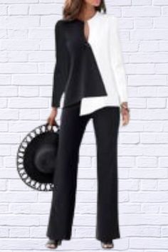 Elevate your style with our sophisticated Black and White Color Blocking Long Sleeve Top and Long Pants Two-piece Set. This chic ensemble is designed to offer both comfort and elegance, making it a perfect addition to your wardrobe for any occasion. Key Features: Color Blocking Design: The striking black and white color blocking creates a bold and modern look that’s sure to turn heads. Two-piece Set: Includes a long sleeve top and matching long pants for a coordinated and polished outfit. Fabric Softness: Enjoy moderate softness for a comfortable fit throughout the day. Non-Stretch Fabric: Designed with non-stretch fabric to provide a structured and tailored look. Fabric Thickness: Thin fabric ensures breathability and comfort, making it ideal for year-round wear. Fit Type: Standard fit of Color Blocking Design, Smart Casual Wear, Kimono Sweater, Black And White Color, Dress Pant, Black And White Colour, Unique Outfits, Cardigan Coat, Long Pants