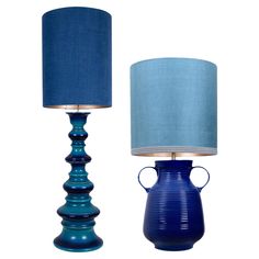 two blue lamps are next to each other