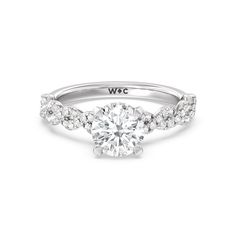 a white gold engagement ring with diamonds on it