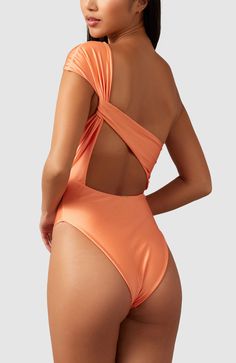 This stunning one piece swimsuit will have you feeling effortlessly classy. It elegantly caps one shoulder and drapes in the back to create a stunning asymmetrical look that will not disappoint. Thick double-lined fabric High cut at legs Cheeky bottoms One Shoulder Stretch One-piece Swimsuit For Beach, One-shoulder Swimwear For Party, Solid One-shoulder Swimwear For Party, Fitted One-shoulder Swimsuit For Pool, One Shoulder Stretch One-piece For Beach, One-shoulder Stretch One-piece For The Beach, Stretch One Shoulder Bodysuit For Beachwear, Stretchy One-shoulder One Piece For Beach, One Shoulder Solid Color Party Swimwear