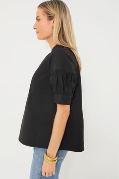 A crisp and classic top never fails, so meet your new closet staple — the Black Ruthie Blouse. Featuring a band collar with a V-neckline, short puff sleeves, and trapunto stitching on the hemline, this polished piece is not short on details. Pair with denim of all colors, flats or heels, statement earrings or gold accessories, the styling options are truly endless! Gathered band collar V-neckline Short puff sleeves with ruching Trapunto stitching at shoulders and cuffs Button at cuffs Trapunto s Cotton V-neck Puff Sleeve Top For Work, Cotton Puff Sleeve V-neck Top For Work, V-neck Cotton Puff Sleeve Top For Work, Blouse Sale, Plus And Minus, Cocktail Attire, New Closet, Closet Staples, Band Collar