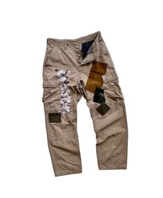 "Description: Uniqueness is here for those who love‼️ It's original army pants, cargo style, double knees, in plain khaki which several military patterns (Camouflage, Desert, Marine, Soldier) were patched as photos shown. It's is a reworked pair of pants in order to make it unique and perfect combination.  Photos and videos describe the product better. So, just have a look-see at them all and read the special features below before you decide to purchase it.  Features: - Patchwork army pants. -  Different military patterns were patched throughout the pants. - Unique design detailing.  - Cargo pants with multi-pockets. - Double knees. - Regular fit. Size: Waist: 31\" (Round) Hips:  40\" (Round) Length: 40.5\" Tight: 26\" (Round) Leg opening: 16\" (Round) Condition: Used and reworked. Gender: Marine Soldier, Military Desert, Camo Pant, Pants Unique, Military Pattern, Army Pants, Cargo Khaki, Pants Cargo, Military Outfit