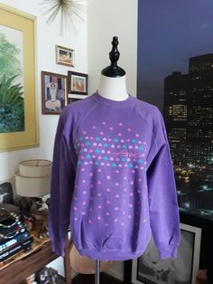 All the 90s vibes when you wear this 'Aspen' multi-heart graphic sweatshirt! The pink, green and lilac hearts with the purple is so cute!  Material/Fabric: Cotton/Poly? Size: M-L? Condition: Excellent Make sure you check out the rest of my shop for more treasures: https://www.etsy.com/shop/1stStateStyleResale Also, go shop my website for more great vintage of all kinds not found here on Etsy: www.1ststatestyleresale.com Follow us on IG: @ 1ststatestyle_resaleboutique     FB: 1st State Style Resale Boutique Insurance included when you choose Priority Shipping! Feel free to contact me with any questions or concerns! Thanks for stopping by! Vintage Graphic Sweatshirt Crewneck Sweatshirts Vintage Sweatshirts Vintage Sweatshirt 90s Sweatshirts 90s Clothing Vintage Sweatshirts Purple Crew Neck Sweatshirt For Spring, Purple 90s Style Tops For Fall, Purple 90s Style Top For Fall, 90s Inspired Long Sleeve Top With Letter Print, 90s Inspired Long Sleeve Letter Print Tops, 90s Style Relaxed Fit Cotton Sweater, Casual Sweatshirt With Heart Graphic For Loungewear, 90s Inspired Long Sleeve Winter Tops, 90s Inspired Long Sleeve Cotton Top