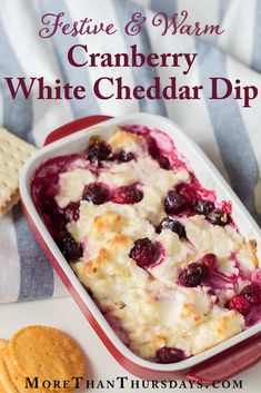 cranberry white cheddar dip with crackers on the side and text overlay reading festive & warm cranberry white cheddar